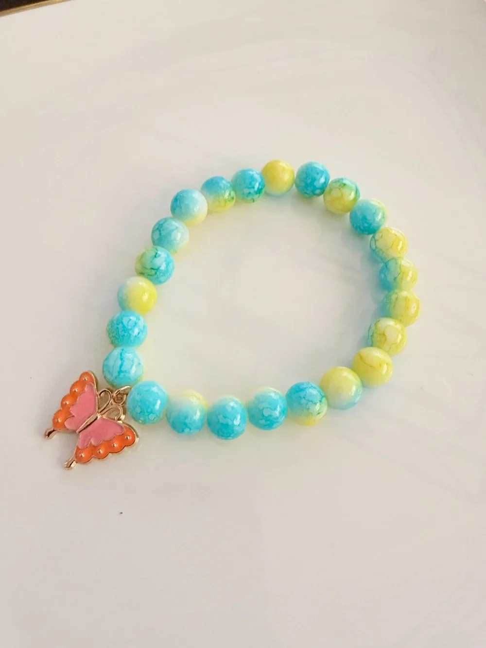 Turquoise & Yellow Beaded Bracelet with Pink Butterfly Charm
